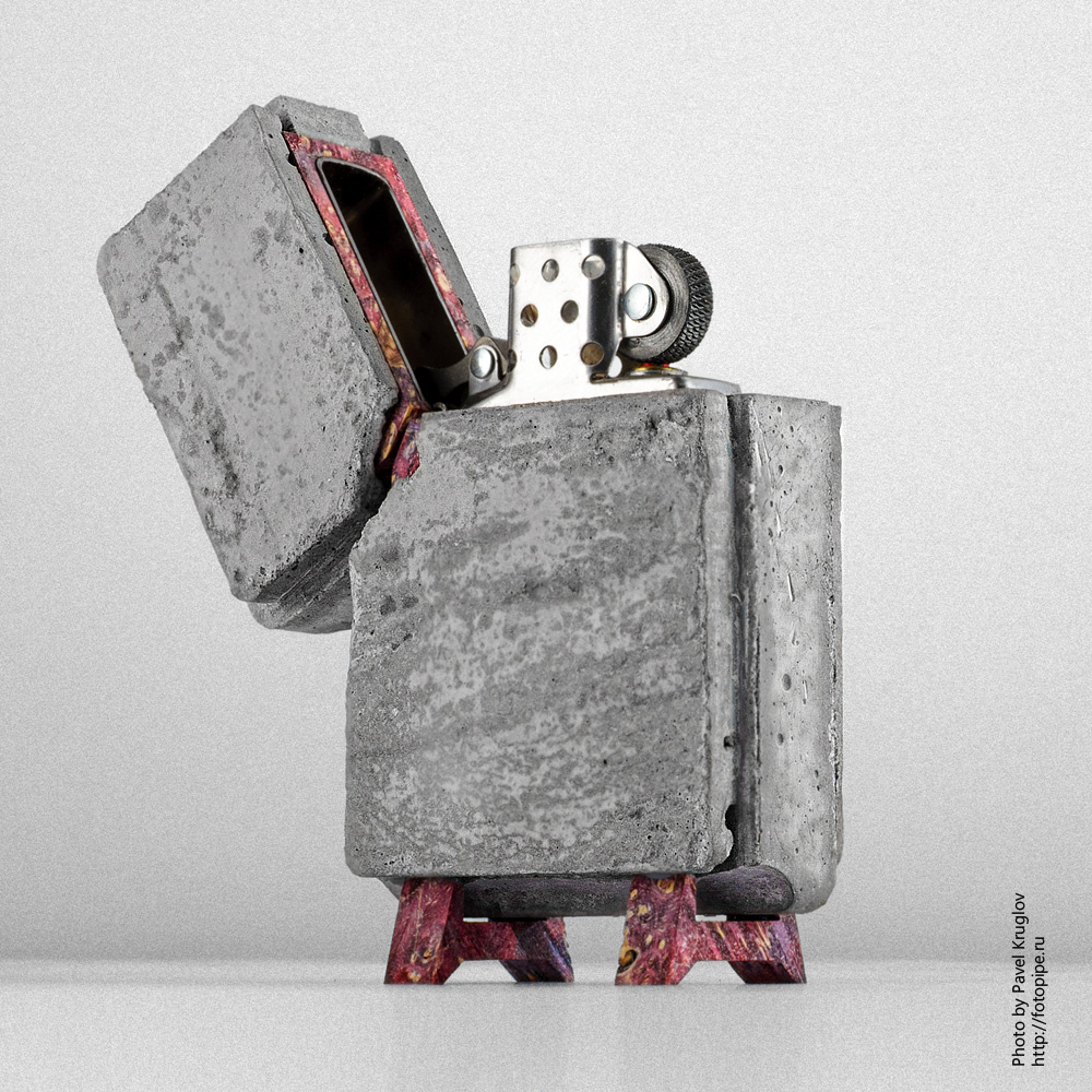Зажигалка Zippo в бетоне. Предметная съёмка