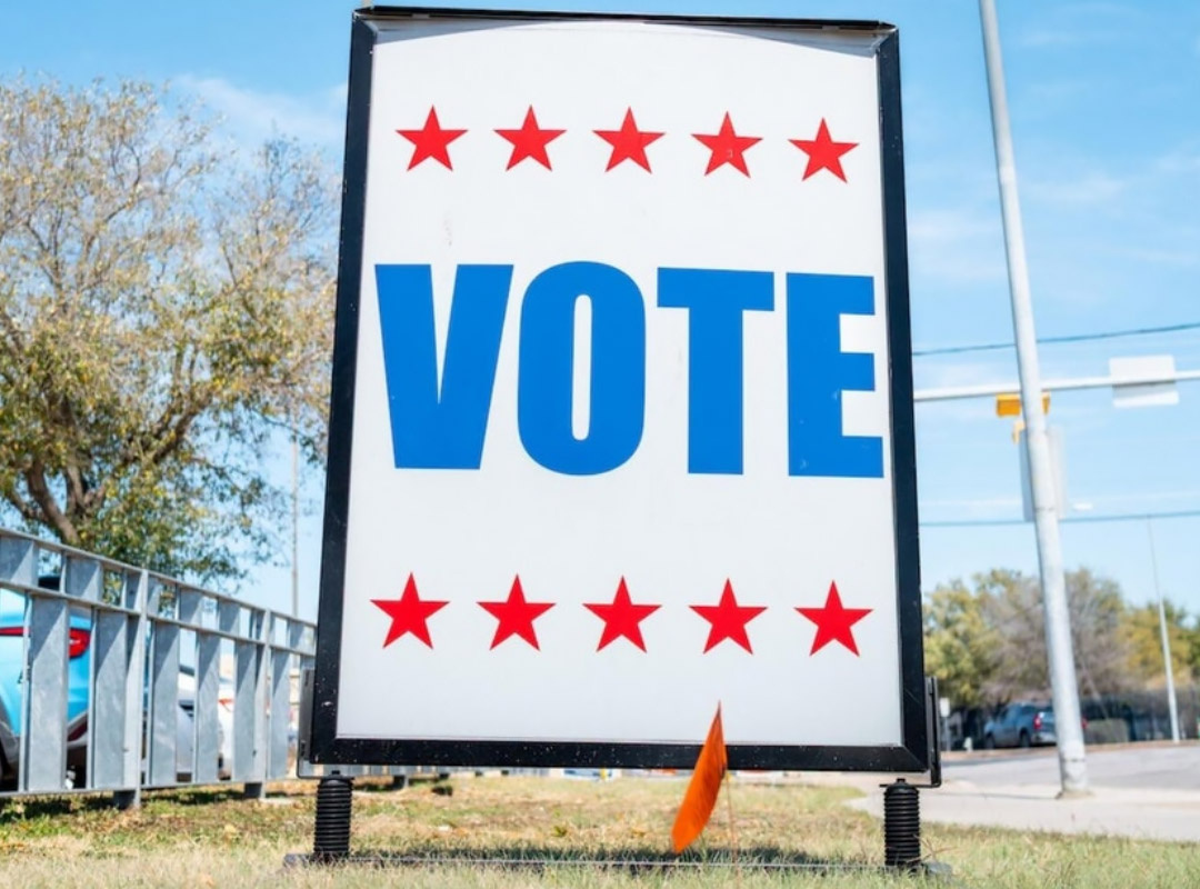 used image: A "Vote" poster in Texas // Internet