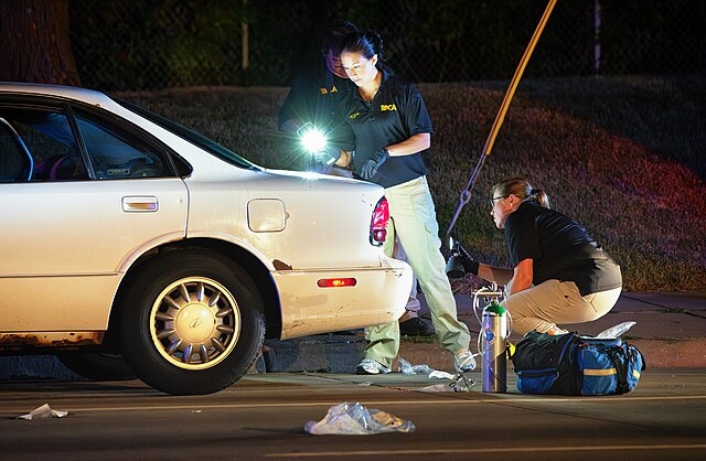    Minnesota Bureau of Criminal Apprehension (BCA) investigators process the scene of where a St. Anthony Police officer shot and killed 32-year-old Philando Castile in a car near Larpenteur Avenue and Fry Street in Falcon Heights, Minnesota, on July 6, 2016. Василий Соколов