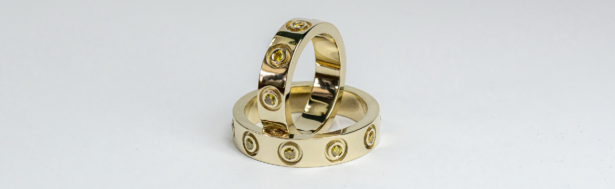 Золотые обручальные кольца с жёлтыми бриллиантами «Люмен»