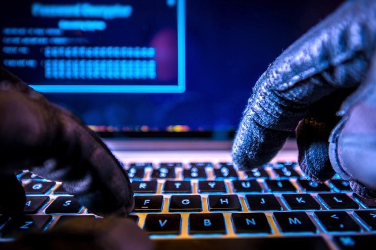    Payments System Hacking. Online Credit Cards Payment Security Concept. Hacker in Black Gloves Hacking the System. Виталий