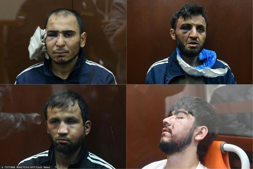 Рачабализода Сайдакрами, Далерджон Баротович Мирзоев, Мухаммадсобир Файзов и Шамсидин Фаридуни (по часовой стрелке) в Басманном суде. Москва, 24 марта 2024 года. Фото: Татьяна Макеева / AFP / East News