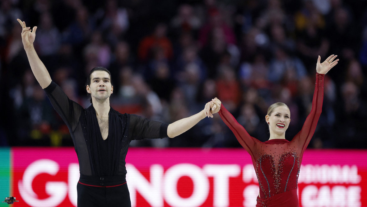    Минерва Фабьенне Хазе и Никита Володин. Reuters