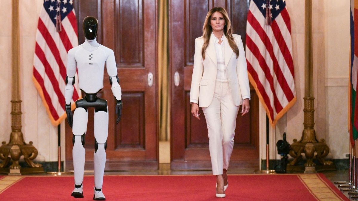 Humanoid robot walks alongside Melania Trump during the White House AI summit in Washington, D.C.