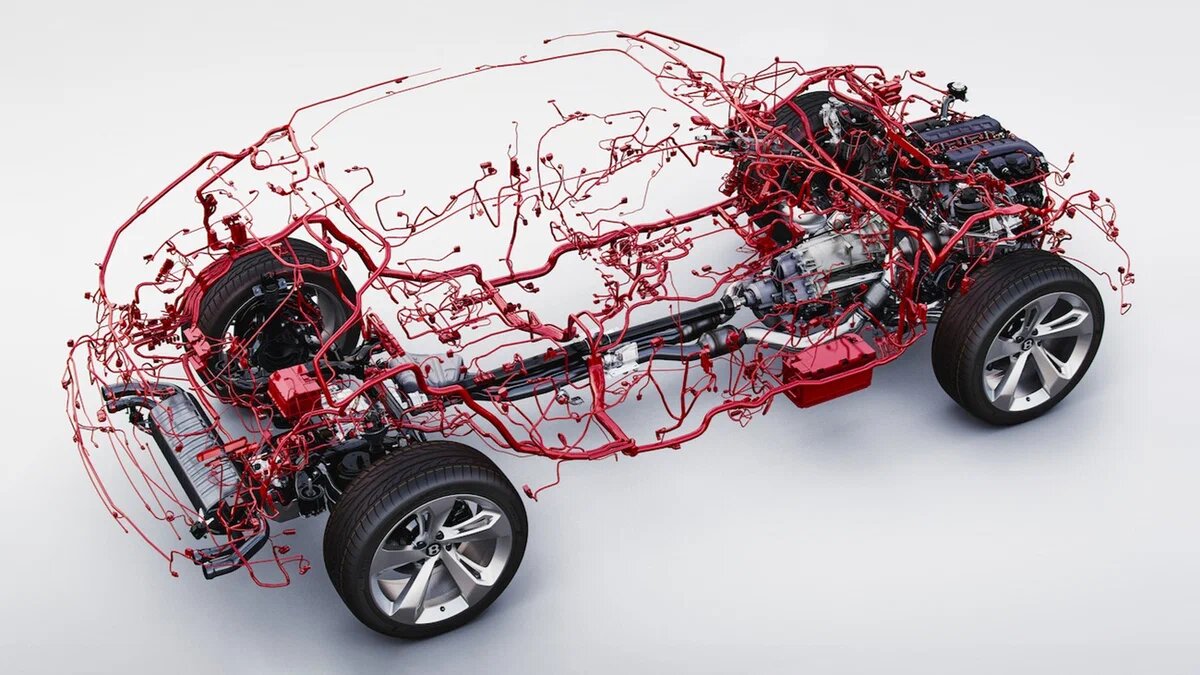Электропроводка — нервная система автомобиля. По проводам разной длины и сечения туда-сюда бегают сигналы — от мигания поворот­ников до запуска мотора и работы АБС. Чем современнее и дороже машина, тем больше проводов ей нужно. Опции, вроде активной подвески, аудио­системы с кучей динамиков или крыши «звёздное небо», вносят вклад в общую электро­сеть. Вот и выходит, что современный Mercedes-Benz S-Class или Porsche Panamera могут скрывать до трёх километров кабелей. Бюджетный Logan тоже не аутсайдер: совокупной длины его проводов точно хватит, чтобы запитать лампочку примерно в 800 метрах от вас.

Удивить можно и владельцев «старины». Так, общая длина двухсот электрокабелей первого VW Golf почти равна высоте главного здания МГУ. Стоит только размотать...