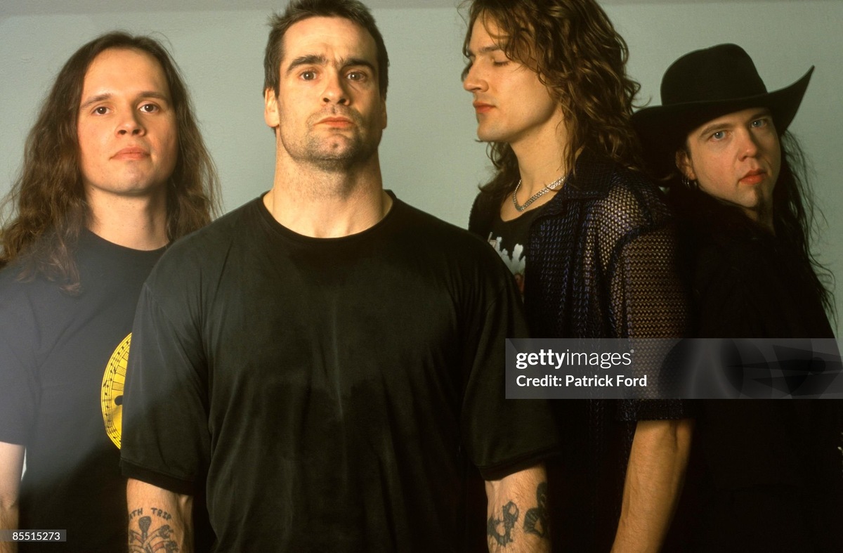 Rollins Band в 1999 году (слева направо): Маркус Блейк (бас), Генри Роллинз (вокал), Джейсон Макенрот (ударные), Джим Уилсон (гитара). Фото из открытых источников.