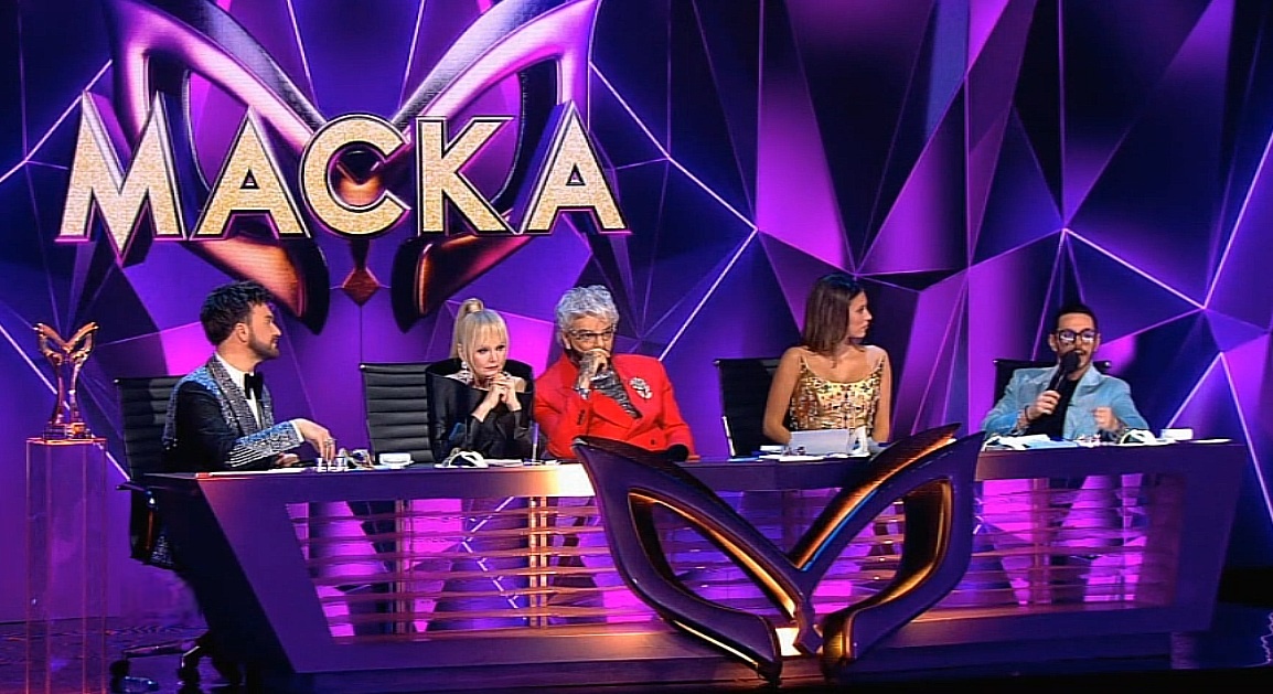 Кто скрывался под маской Снегиря? Кто снял маску в 9 выпуске шоу "Маска 7" от 05.04.26? Какие песни спели участники? Жюри угадали певца?