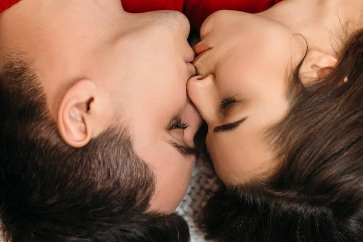    The lovely couple in love lie on the bed Александр Петров