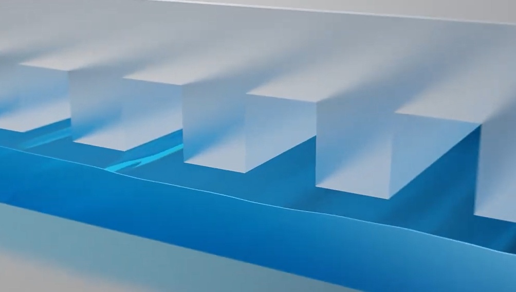 В наноимпринтном литографе рисунок микросхемы формируется штампом (на рисунке сним цветом изображён фоторезист, прозрачным цветом — штамп). Изображение: скрин global.canon