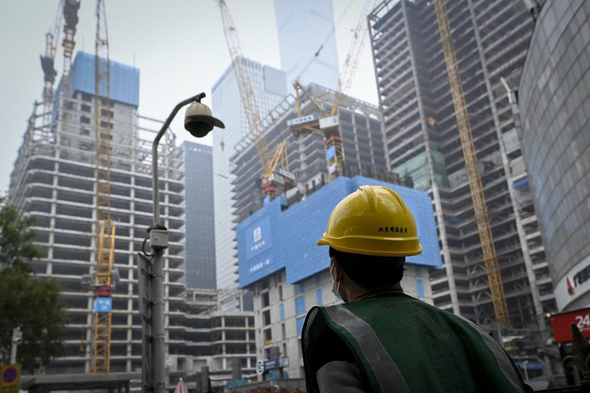 WANG ZHAO / AFP or licensors
Большая стройка в Пекине.