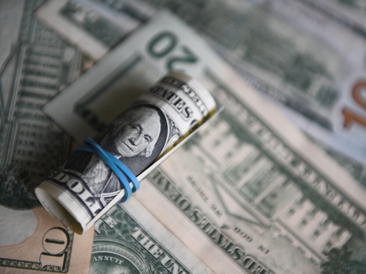    Денежные купюры США© РИА Новости . Нина Зотина