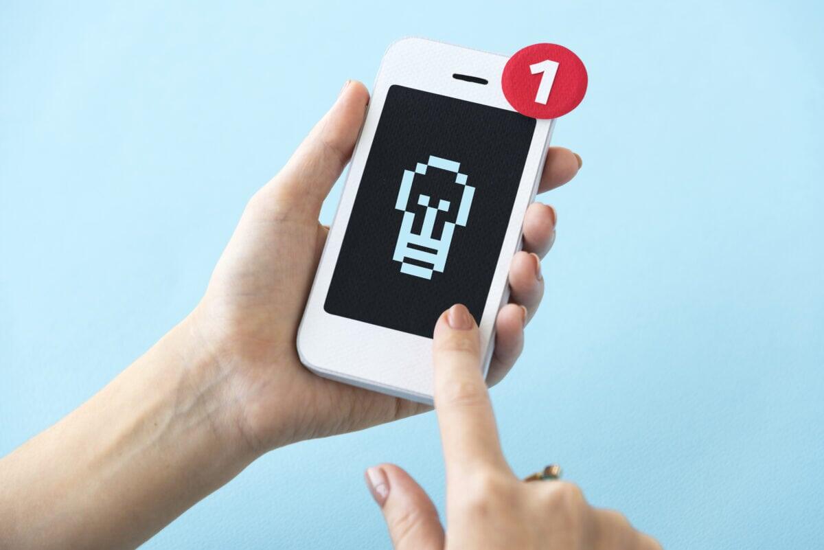    Closeup of hands holding paper craft mobile phone mockup Александр Петров
