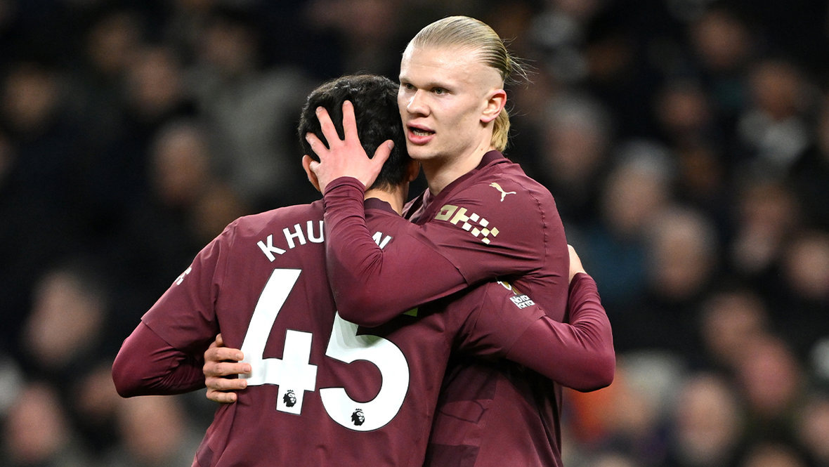    Абдукодир Хусанов и Эрлинг Холанн. Getty Images