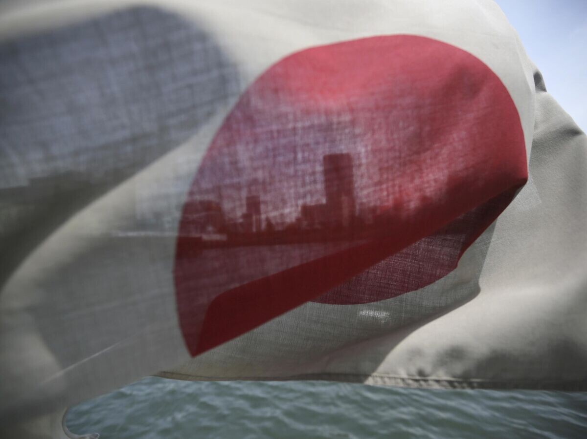    Флаг Японии | © AP Photo / Eugene Hoshiko