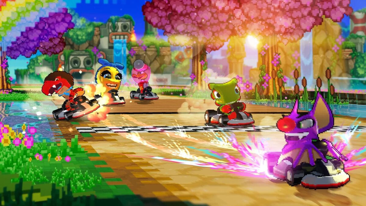    Colorful cartoon go-kart race on a sunny, flower-filled track with bright trees and a rainbow backdrop.
