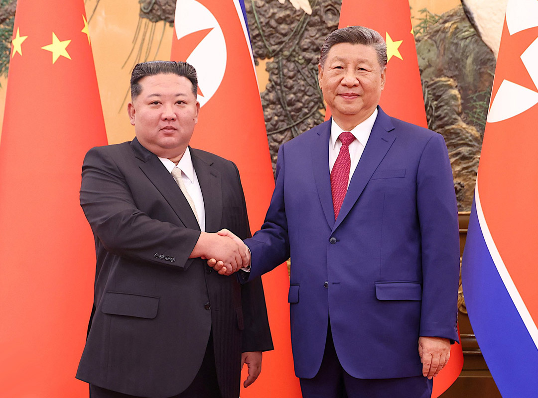 used image: Xi Jinping and Kim Jong Un shake hands // Internet
