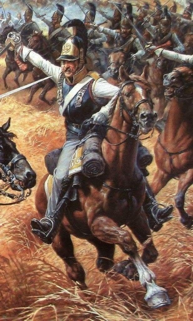 За отсутствием портрета полковника Каратаева Василия Ивановича (1762 - 1813) попробуем представить то, как бы выглядел первый командир Астраханского кирасирского полка на поле Бородинской битвы. Картина «Контратака кирасиров саксонского полка „Гард дю Кор“ против кирасир Астраханского полка при Бородино, 7 сентября 1812 года» создана российским художником-баталистом Александром Николаевичем Ежовым. Ссылка: https://vk.com/wall-7463178_1001044?ysclid=mool4ctmju64480529 Для справки: Саксонский полк «Гард дю Кор» входил в состав 7-й дивизии тяжёлой кавалерии. В ходе Бородинского сражения он первым перешёл овраг и попытался обойти деревню Семёновское. Атакой руководил генерал-лейтенант Иоганн Тильман. Астраханским кирасирским полком командовал полковник Василий Иванович Каратаев, который в ходе сражения получил два ранения. В ходе контратаки командир полка «Гард дю Кор» полковник Август Лейссер с небольшим отрядом прорвался далеко вперёд, опрокинул русских драгун, но при отступлении наткнулся на русских кирасир, был ранен и взят в плен. Александр Ежов — ведущий художник военно-исторического журнала «Воин». Батальный жанр занимал особое место в его творчестве. Для справки: Саксонские полки Гар-дю-Кор и Цастрова сначала атаковали русскую пехоту (вероятно, это были остатки 27-й пехотной дивизии, построенные в каре) севернее деревни Семёновское, затем столкнулись с русскими драгунами и кирасирами (возможно, это был Орденский кирасирский полк). Наконец, после этого на фланге у саксонцев появились русские кирасирские Его и Ее Величеств и Астраханский полки, а также Киевский и Новороссийский драгунские, а чуть позже и гусарский полк (возможно, Ахтырский). Ссылка: https://www.vokrugsveta.ru/vs/article/7843/?ysclid=mo5lhw5sdd273542808
