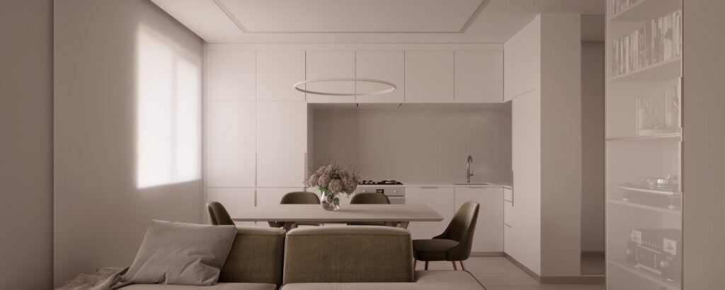 Большое единое пространство квартиры выполняет сразу несколько функций: это и кузня с просторной обеденной зоной, и гостиная, и спальня, которая заняла нишу. Несмотря на легкость, интерьер очень плотно наполнен зонами хранения. Мебель, занимающая всю вертикаль стен с фасадами, сливающимися с оттенком стен, визуально совсем не загромождает пространство.