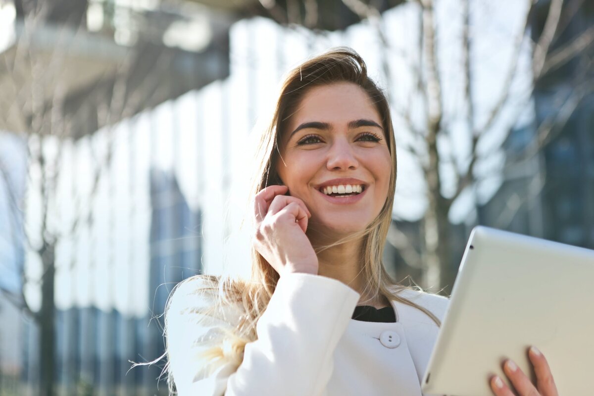 https://www.pexels.com/photo/woman-in-white-blazer-holding-tablet-computer-789822/