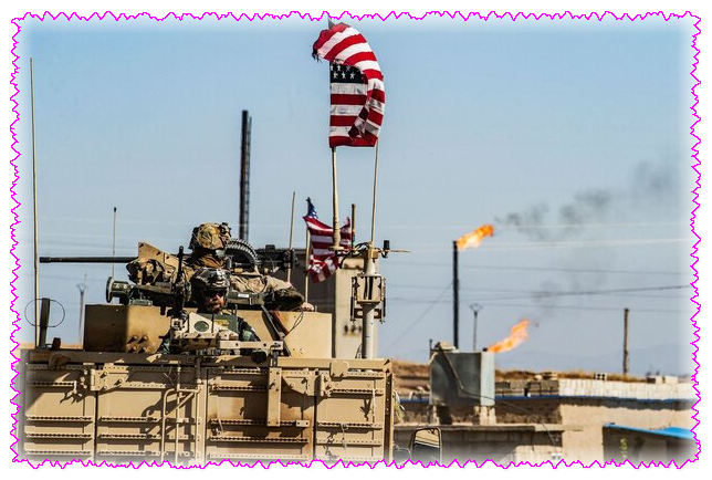 Военный патруль США проезжает мимо нефтяной скважины