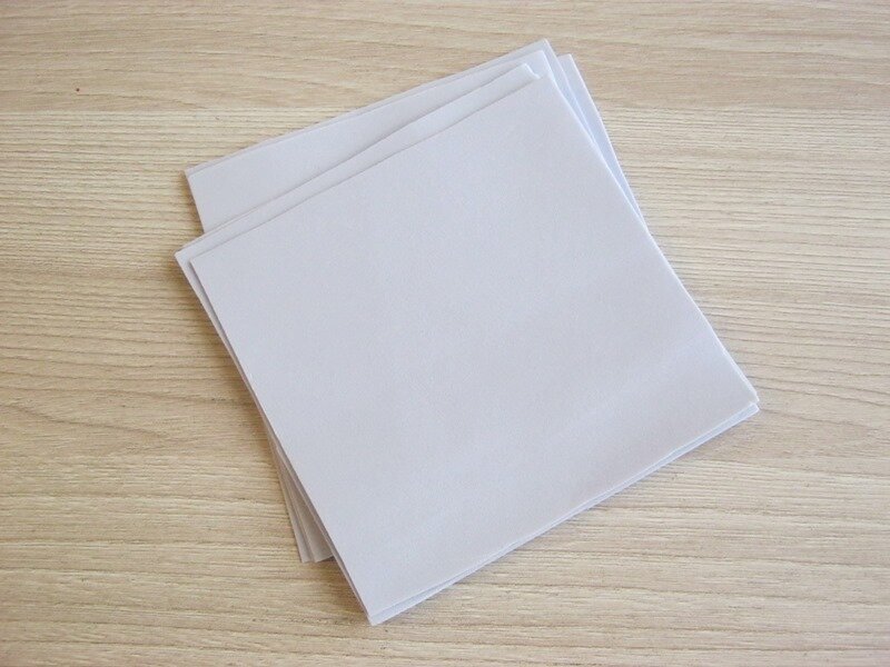 Затем квадратики складываем треугольниками дважды.