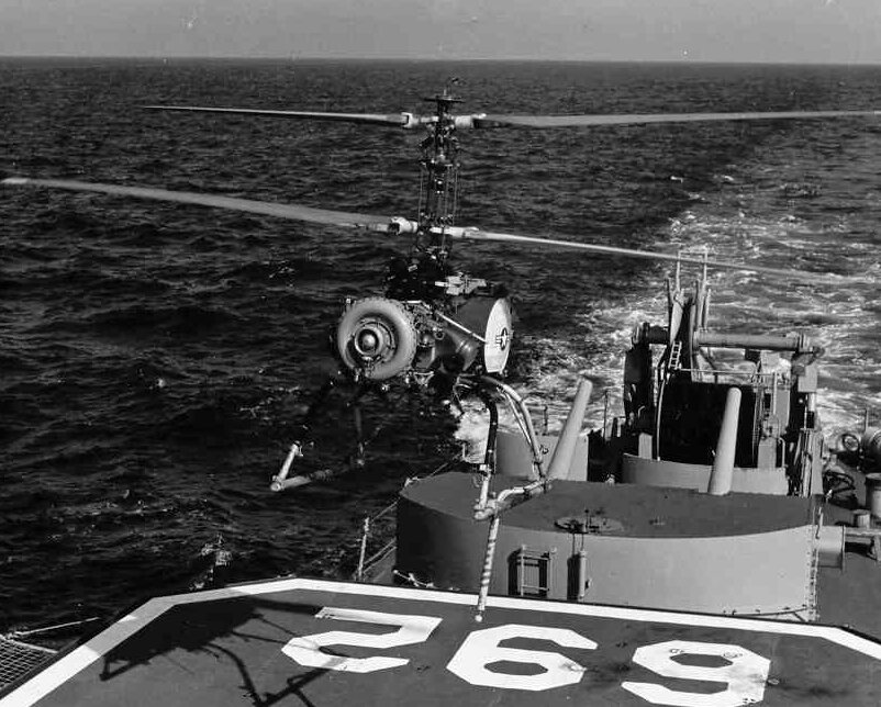 Продукт "холодной войны". Размеры американских кораблей того времени не позволяли размещать на палубе полноразмерные вертолёты.  Для это и был разработан этот компактный дрон.