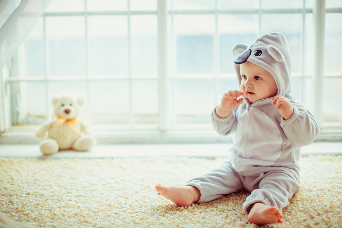 beautiful-little-boy-sitting-by-the-window