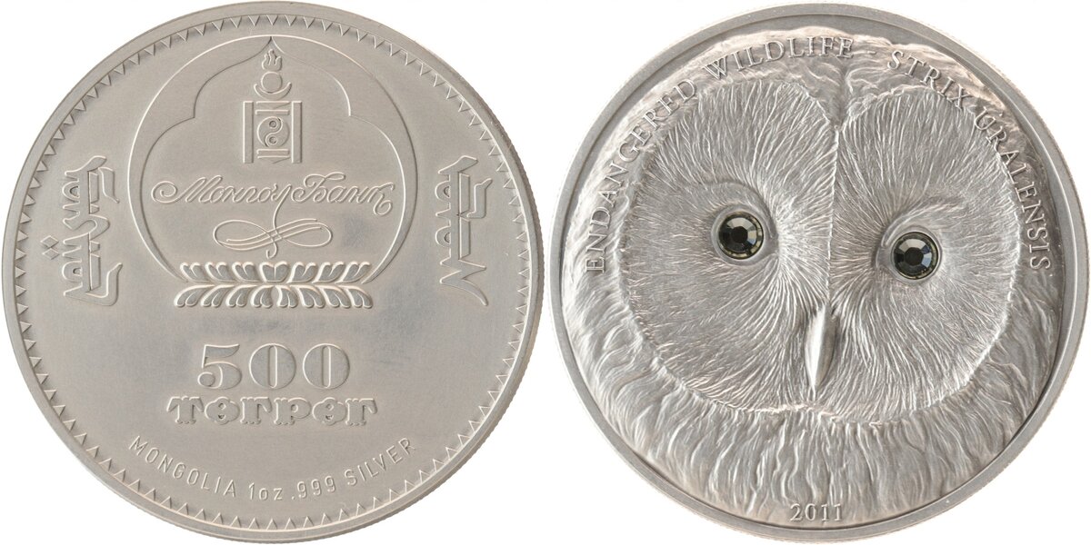 Ну, как живая, честное слово: что глаза, что рельефные "матированные" перья придают данной птахе на монгольской серебряной монете 2011 года довольно очаровательный вид (номинал: 500 тугриков, проба: "три девятки")