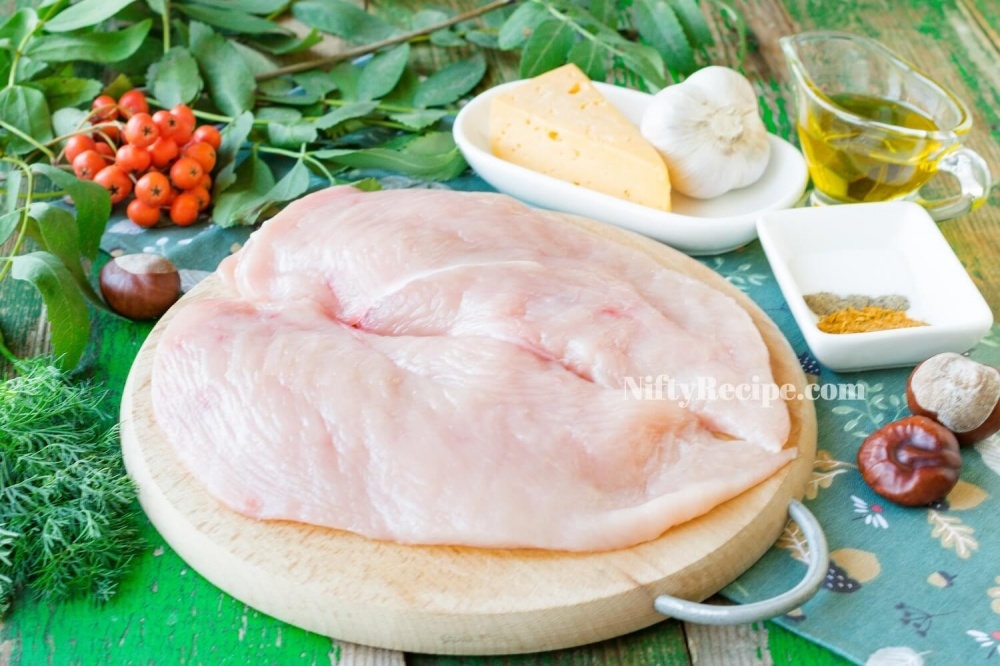 1. Wash chicken fillet, clean it from fat and skins. Cut the fillet along into two pieces of the same thickness.