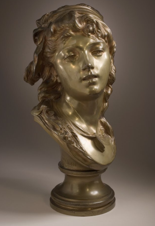 Бюст молодой женщины, Огюст вдохновился романтическими работами конца 18 века, во время отъезда из Брюсселя. Работа выполнена в 1873 году. Вскоре Огюст продал работу одной брюссельской компании из-за финансовых трудностей.