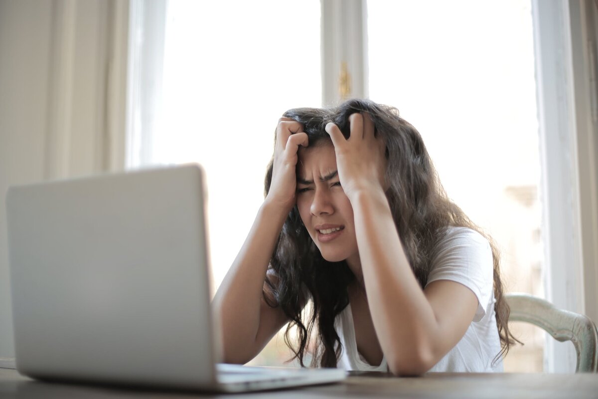 https://www.pexels.com/photo/woman-in-white-shirt-showing-frustration-3807738/