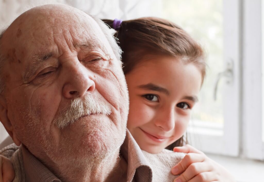 Little granddaughter loving her grandfather