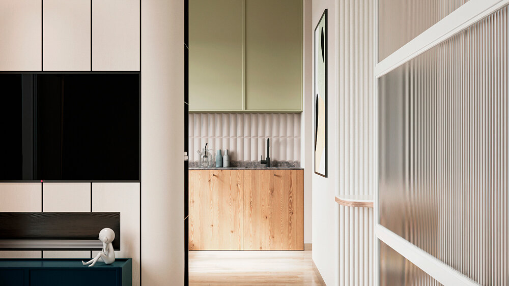 Кухня выполнена с использованием фасадов Komandor с фрезеровкой «Викинг» в цвете «Шалфейный», столешница из искусственного камня, а нижние фасады из плитных материалов Egger в декоре Лиственница горная коричневая.