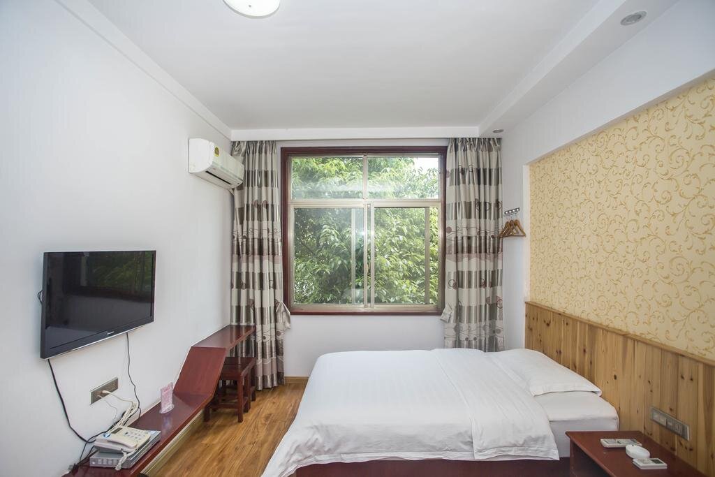 Номер в отеле Zhangjiajie Yijiaqin Hotel. Фото со страницы отеля на booking.com