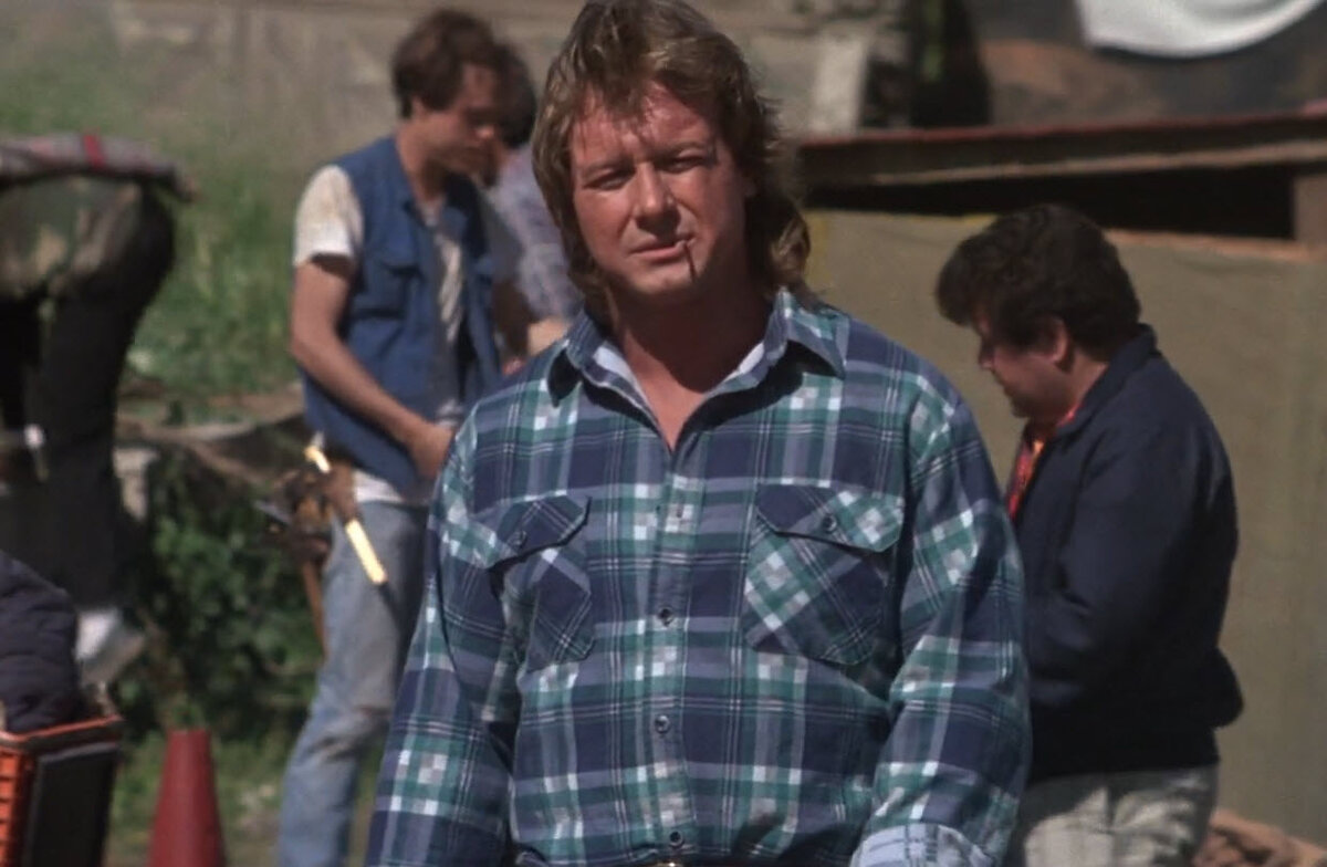 Кадр из фильма «Чужие среди нас» 1988 года. Джон Нада в исполнении Родди Пайпера.