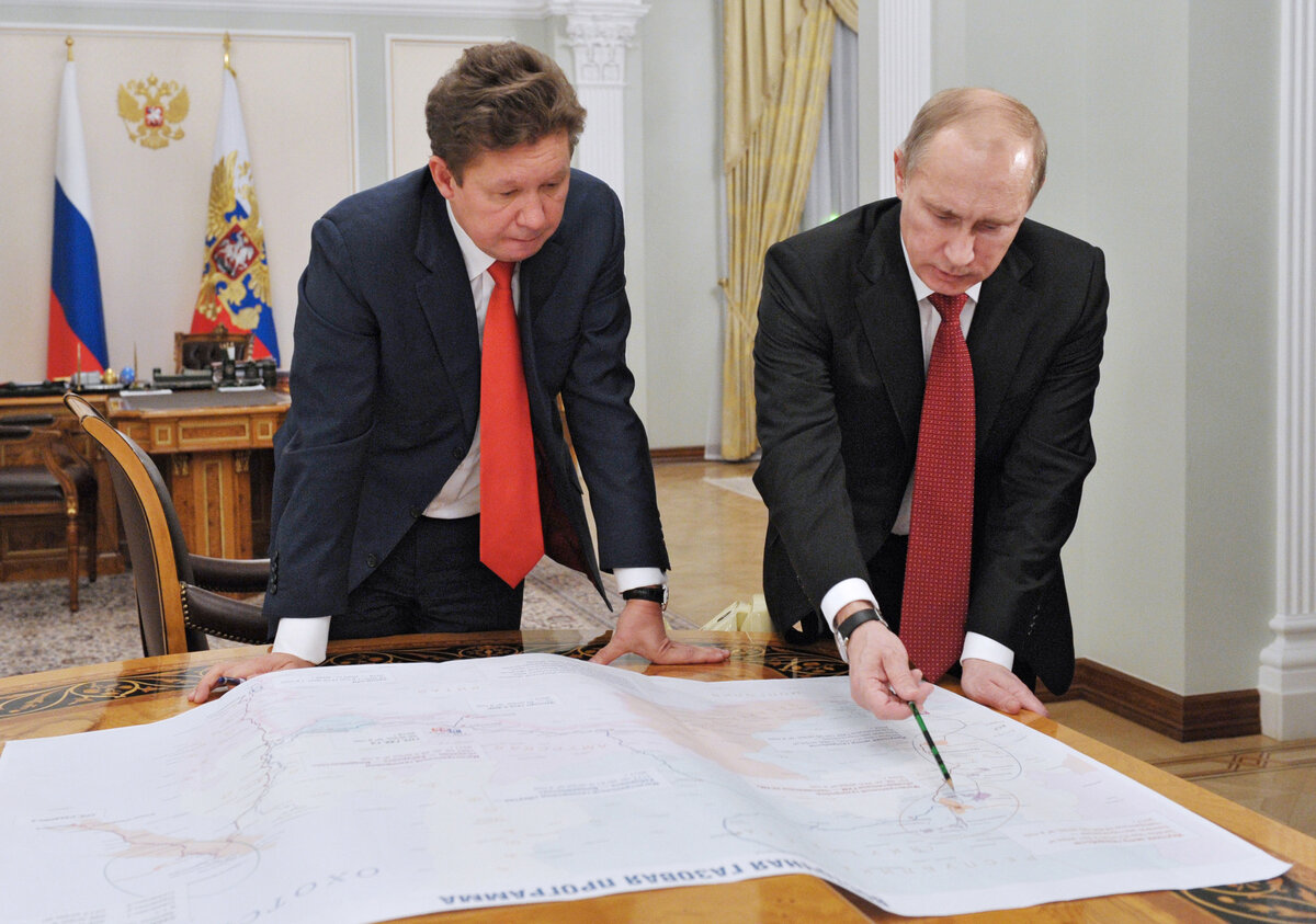 http://blogs.reuters.com/great-debate/files/2014/04/putin-oil-exec.jpg