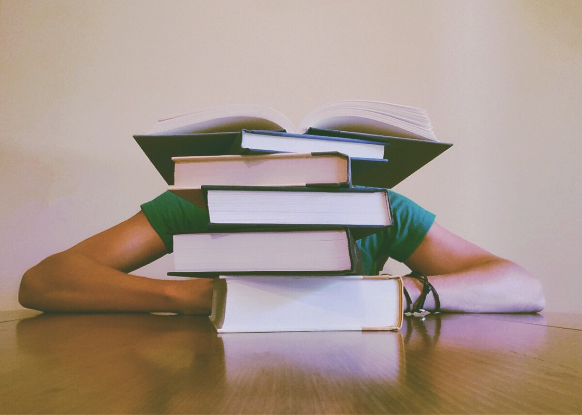 https://www.pexels.com/photo/adult-blur-books-close-up-261909/