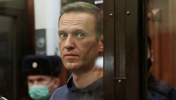 A still image taken from video footage shows Russian opposition leader Alexei Navalny, who is accused of flouting the terms of a suspended sentence for embezzlement, inside a defendant dock during the announcement of a court verdict in Moscow, Russia February 2, 2021. — Reuters/File