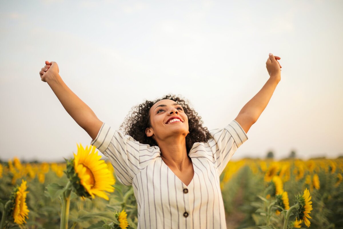 https://www.pexels.com/photo/photo-of-woman-standing-on-sunflower-field-3756168/