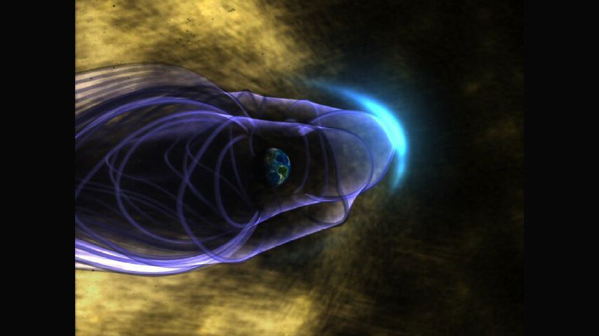 Рисунок художника, на котором показан изгиб магнитного поля Земли. Многие частицы в солнечном ветре, представленные золотым цветом, отклоняются магнитным «щитом» Земли. Фото: space.com