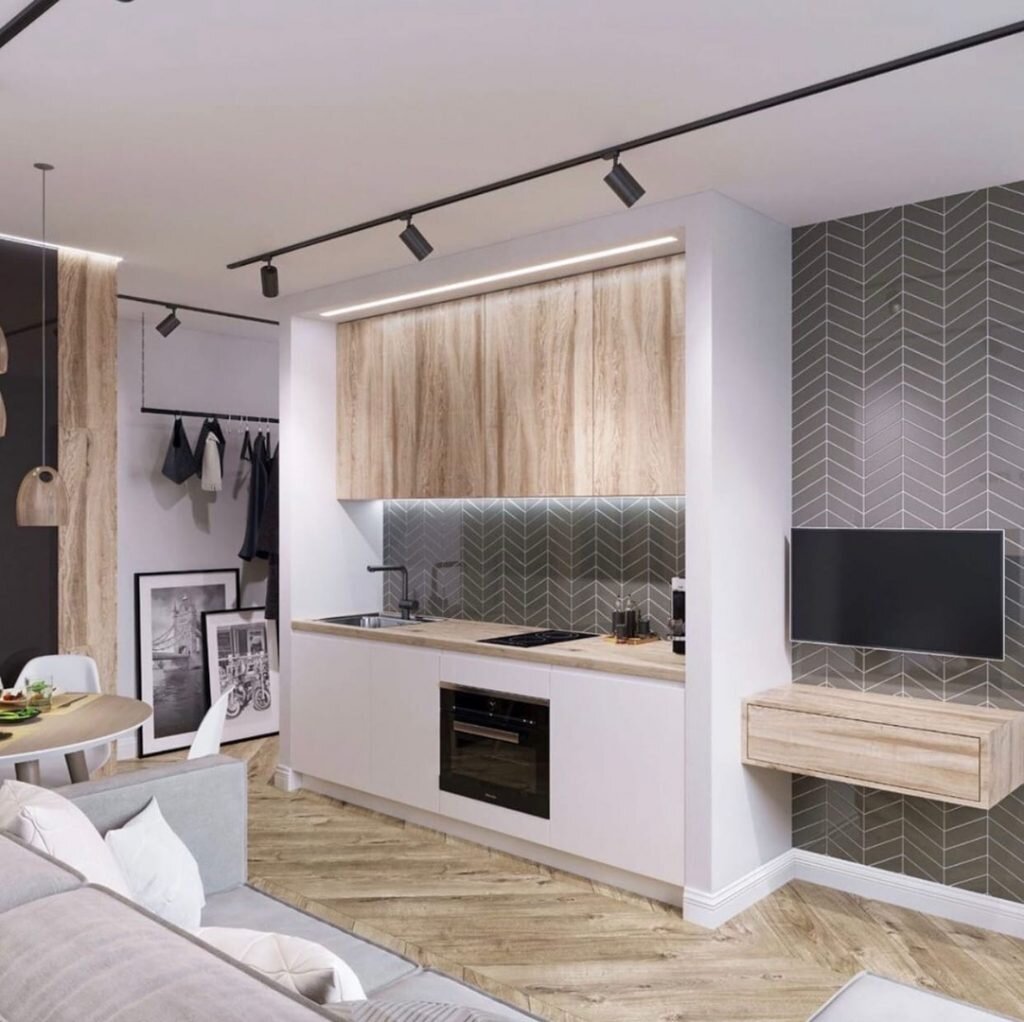 Дизайнеры студии дизайна интерьера «YARANGA» создали этот интерьер однокомнатной квартиры площадью 31 м² с лесом в спальне с любовью к природе и это видно в каждой детали. Традиционны для скандинавского стиля натуральные материалы дополнены модными акцентами, что создает персонализированный интересные интерьер.