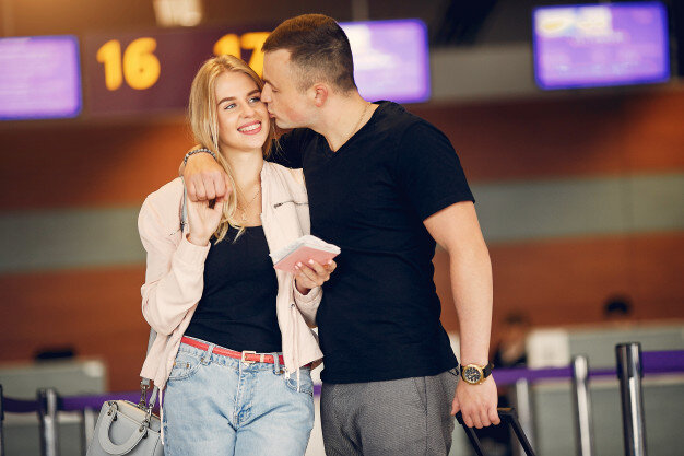 https://image.freepik.com/free-photo/beautiful-couple-standing-in-airport_1157-22079.jpg