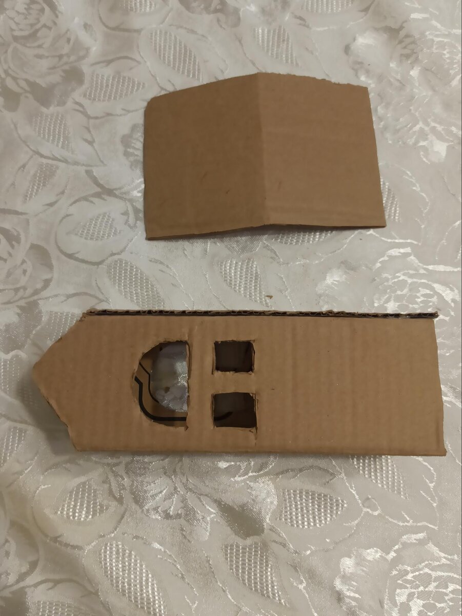 Склеили на горячий клей, вырезали окна (которые потом изменили)