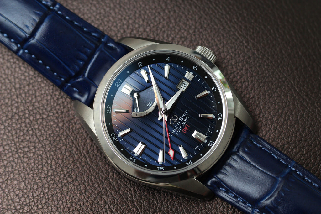 Одни из самых красивых наручных часов Orient Star с усложнением даты, запаса хода и GMT