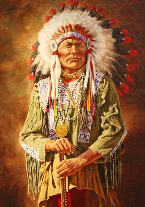 Индеец в пончо с бахромой.