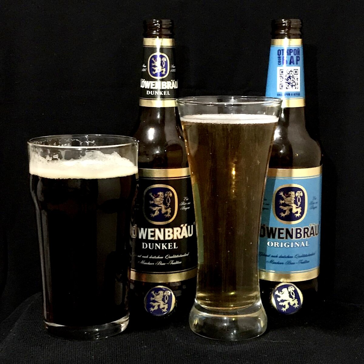 Пиво Löwenbräu разлитое по бокалам.