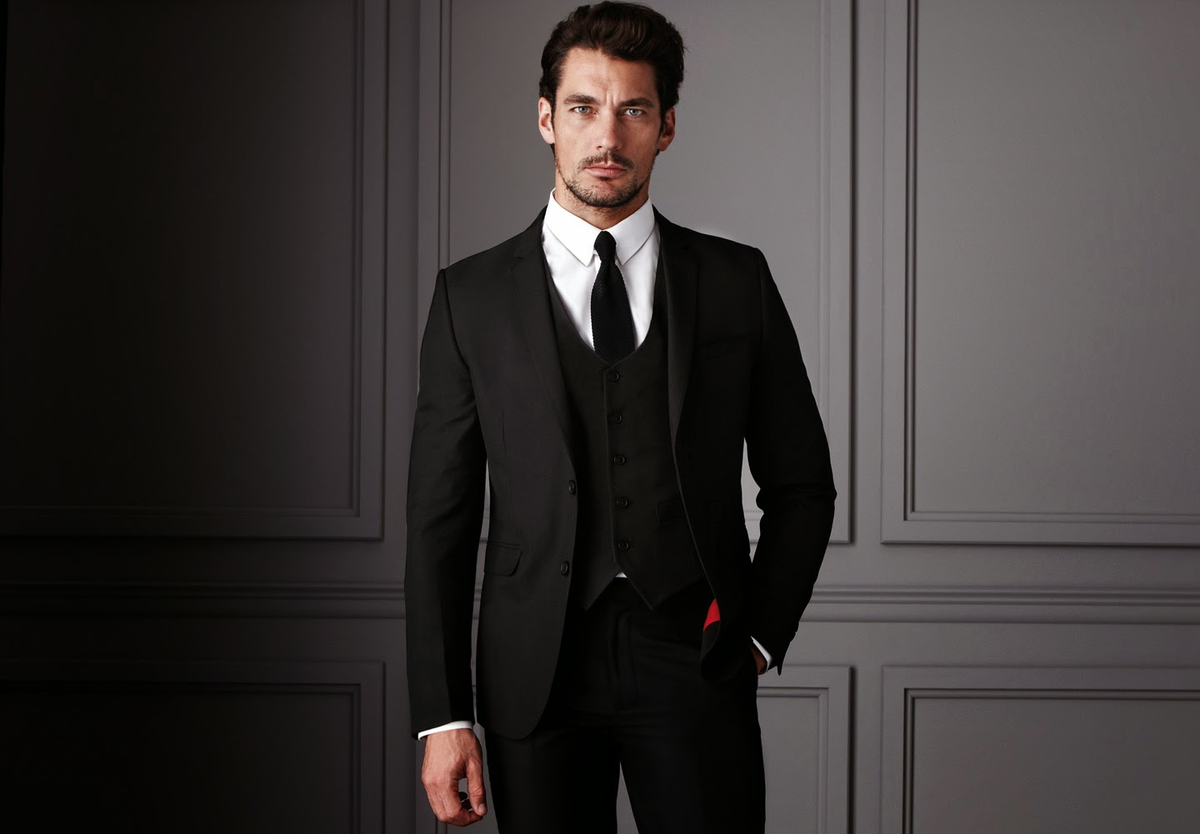 успешный мужчина. элегантный мужчина. дэвид ганди в пиджаке. деловой костюм. уверенный мужчина.