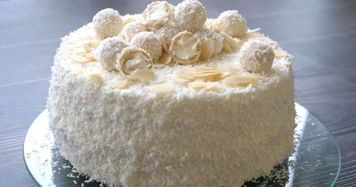  Многие любят воздушные конфеты "Рафаэлло", но не все знают, что это лакомство можно легко приготовить в домашних условиях. Давайте состряпаем целый торт и порадуем всех домочадцев!