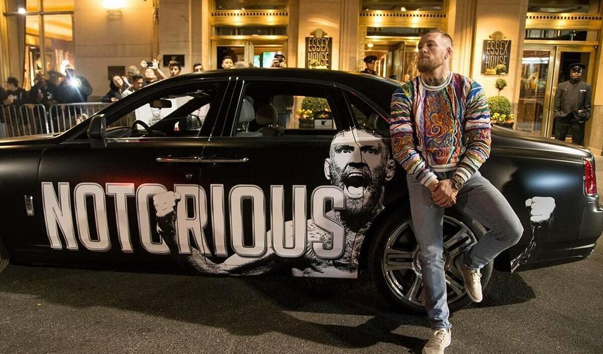 https://playerswiki.com/uploads/2018/12/17/479x284xconor-mcgregor-with-his-customized-rolls-royce-1545041122.jpg.pagespeed.ic.ruH9s0mGqZ.jpg
