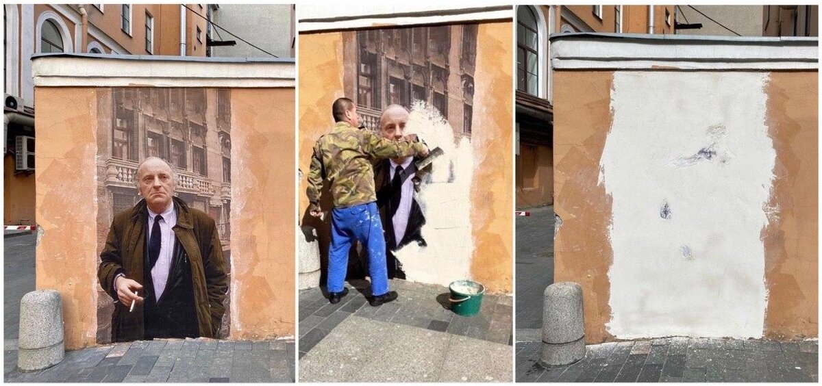 Рабочий закрашивает граффити-портрет Бродского напротив Дома Мурузи в Санкт-Петербурге